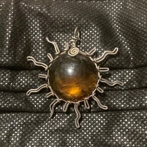 Brown and Silver Sunburst Charm  with Amber Center